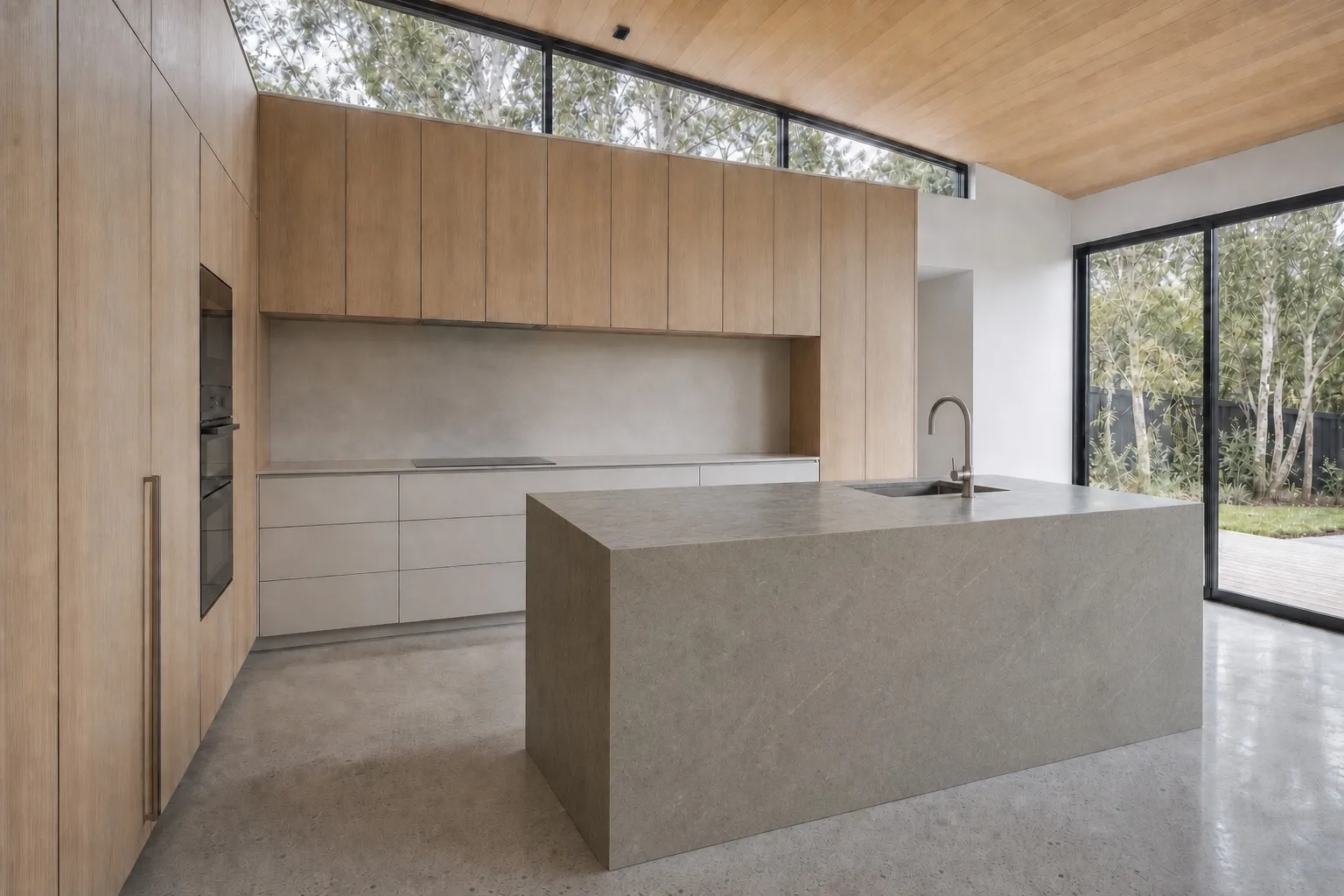 Warm timber kitchen with stone island and garden glazing